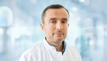 Dr. Midgat Mustafi